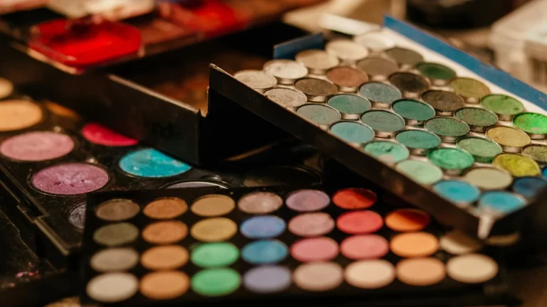 A vibrant close-up of assorted makeup palettes showcasing diverse colors and textures